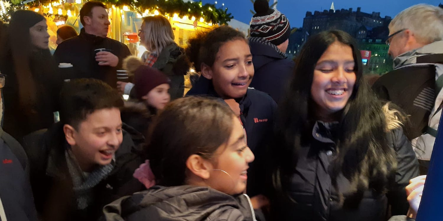 People outside smiling at event on Princes Street