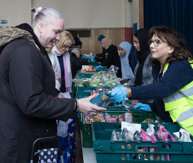 Volunteers with the community fridge