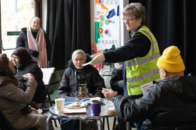 Volunteers with the community fridge