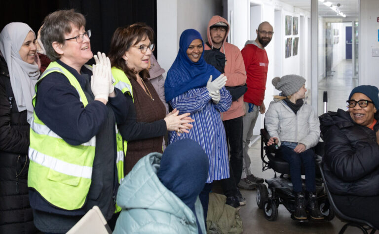 Volunteers with the community fridge