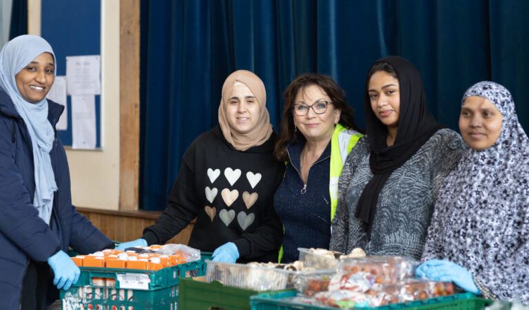 Volunteers with the community fridge