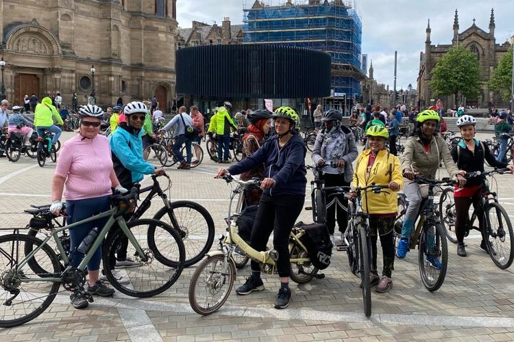 Group of cyclist on a guided trip, at Bristo Square.