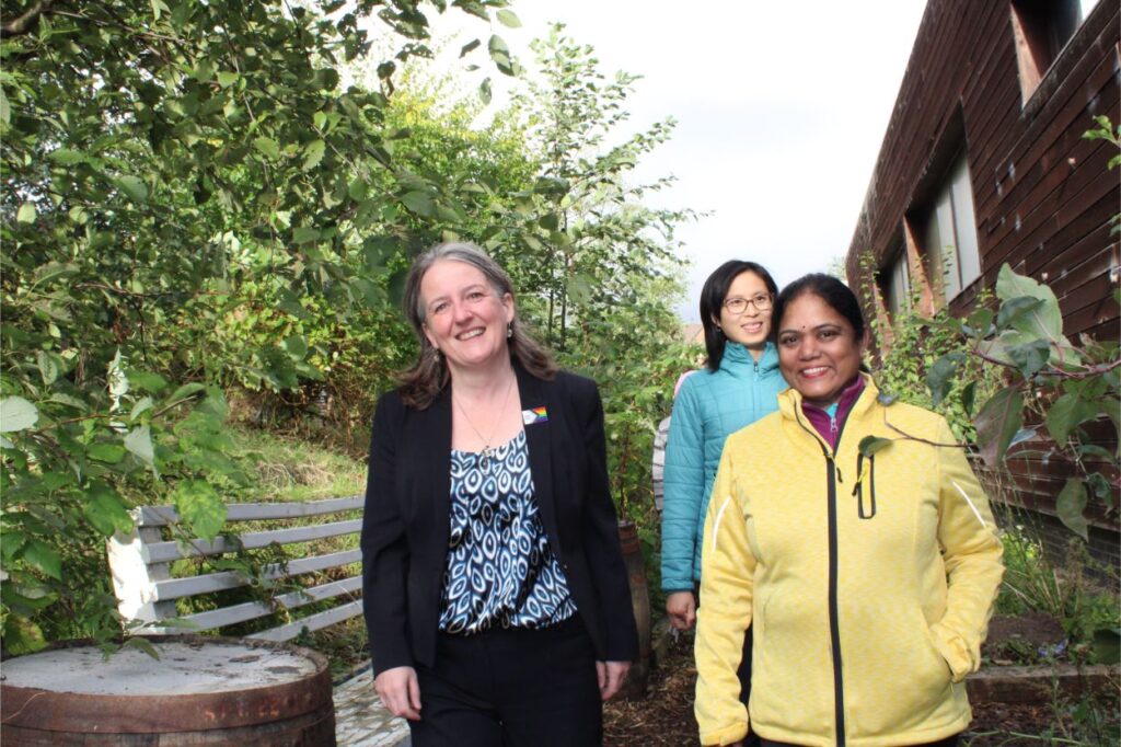 Maree Todd walking round the centre with staff