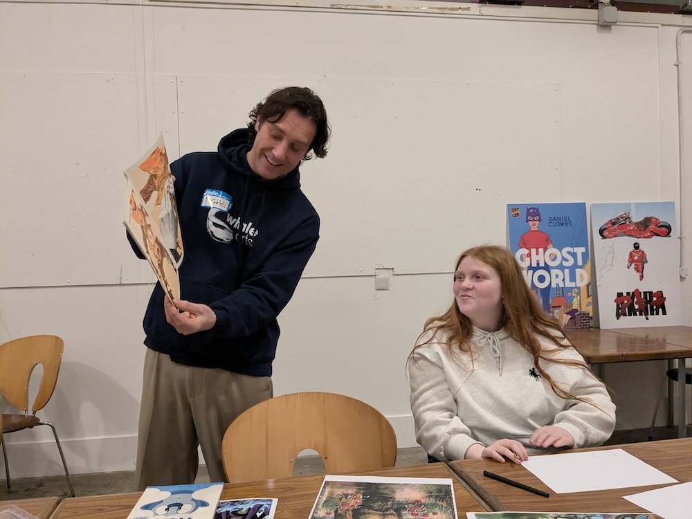 teacher with comics in class