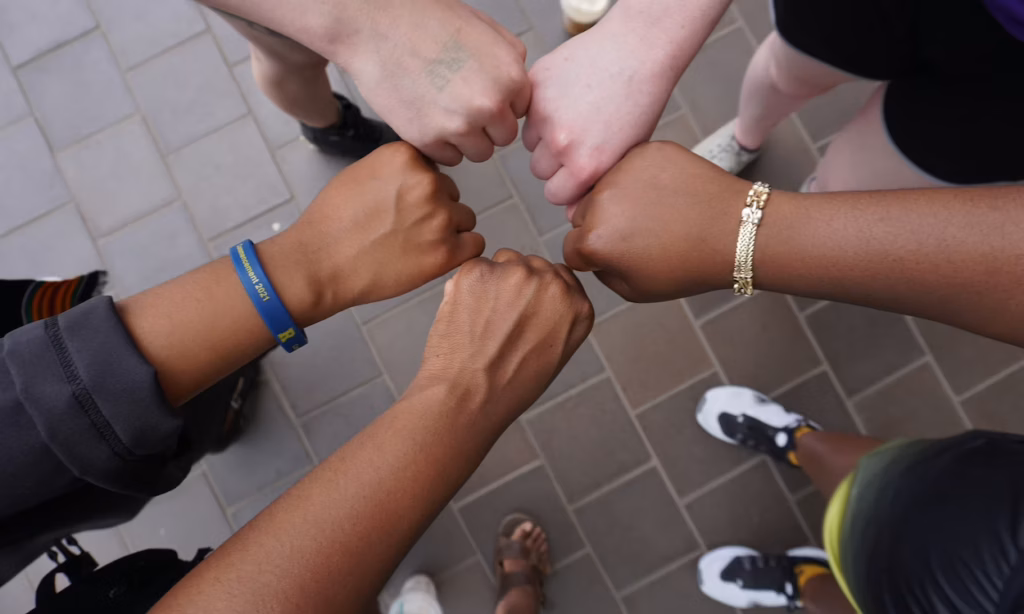 rising together hands image 2026