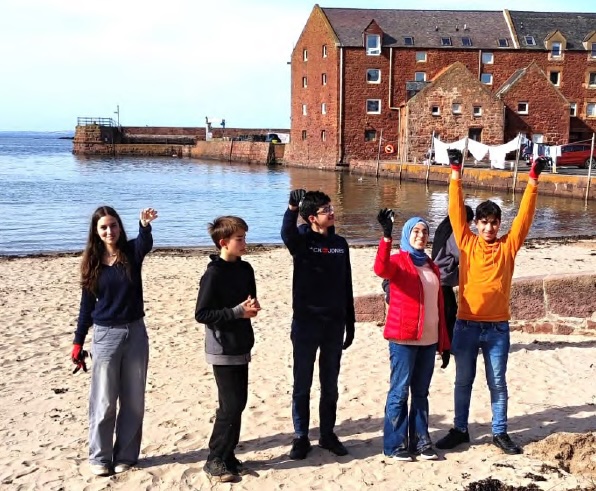 young people on North Berwick beach with SCOREscotland