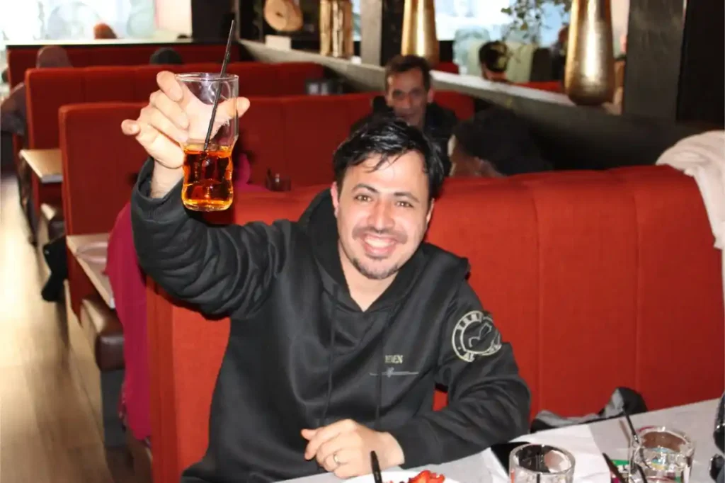 volunteer raising a glass to Scorescotland